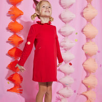 Girls/Tween knit dress in red features a 3 button closure on back with a ruffle neckline at the collar for a relaxed but secure fit. Dress is made of a super soft/stretchy material for easy play while wearing.