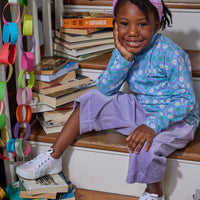 Little girl seen wearing our Lilac Corduroy Cropped Palazzo pants paired with our Turtleneck in Seville Azul---BISBY girl
