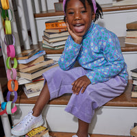 Little girl seen wearing our Lilac Corduroy Cropped Palazzo pants paired with our Turtleneck in Seville Azul---BISBY girl