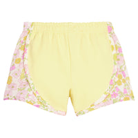 BISBY girl knit yellow track shorts with woven yellow and pink floral print detail along sides of shorts. Shorts feature an elastic waistband as well for a secure but relaxed fit.