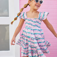 BISBY girl in our new Twirl Dress in our Alli Stripe. This dress features smocking on the bust and has angel sleeves for a more elevated look. Made from a super soft material, this pink/green/ and cream dress is the perfect, comfortable, flowy dress for summer.
