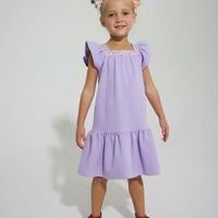 tween girls drop hem dress with floral trim around the neck