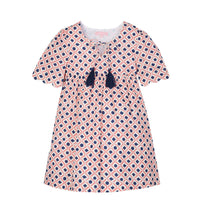tween girls pink and navy geo print dress with scalloped sleeves and navy tassels