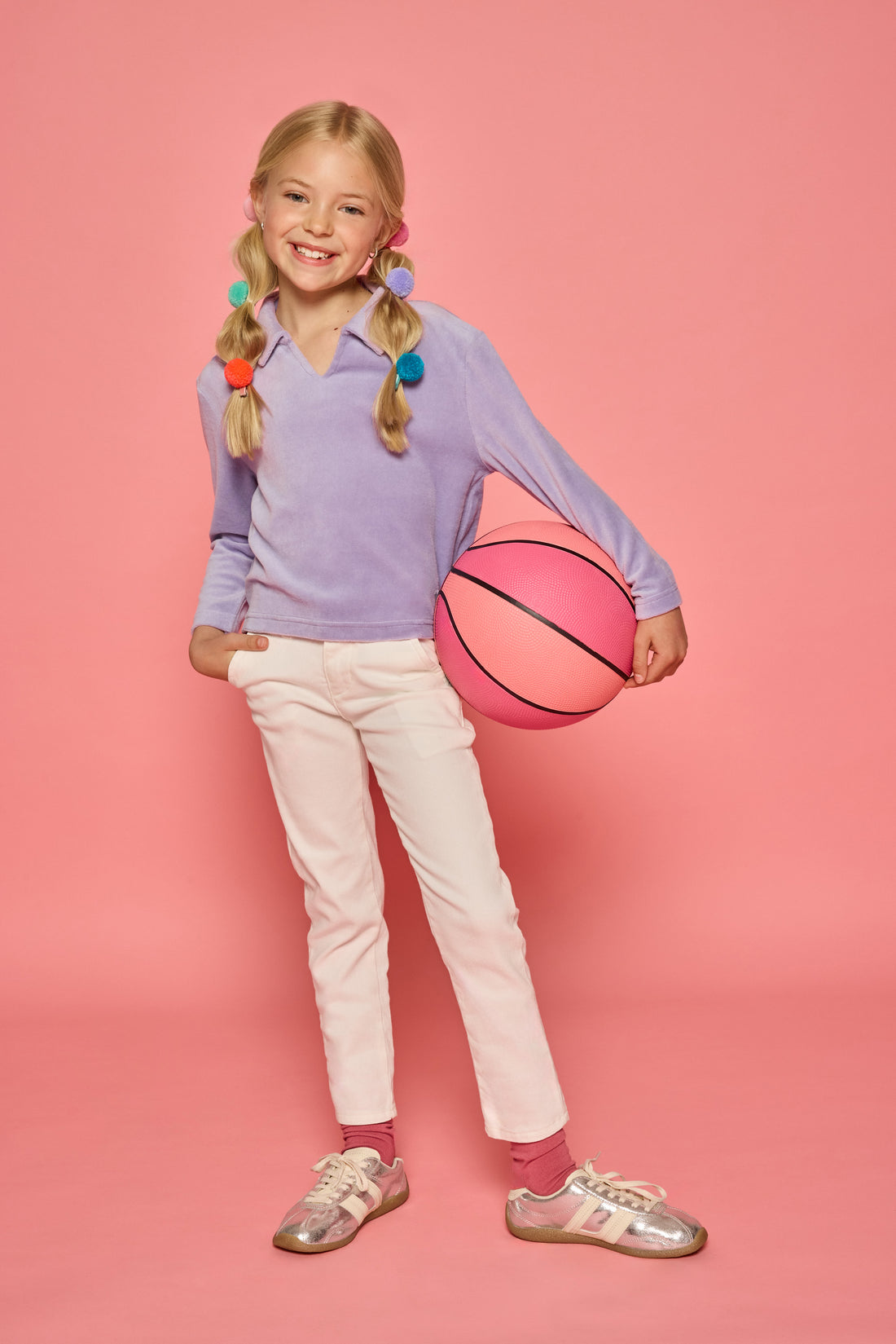 Model can be seen wearing a lavender pullover that features a fold over collar for easy over the head access. Paired back with basic white denim jeans to complete the look. 
