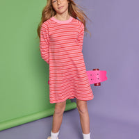 Model can be seen wearing a red and pink stripe knit dress. Dress features a thick pink neckline for an elevated look. 