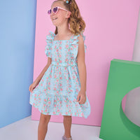 Tween model can be seen wearing a woven light blue/pink floral print that features an elastic waistband and angel flutter sleeves for a secure but comfy fit. 