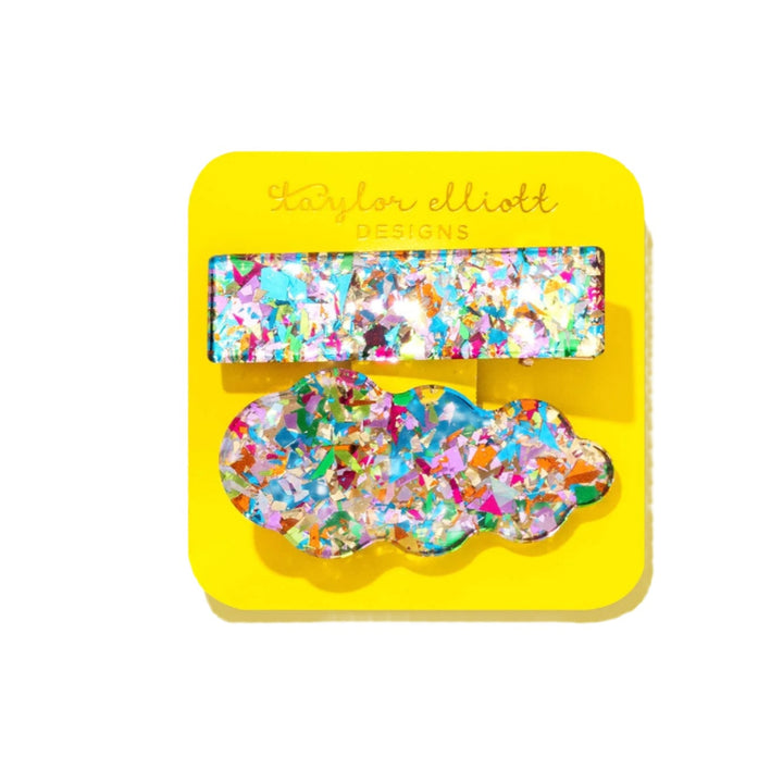 Colorful hair clips on a yellow card