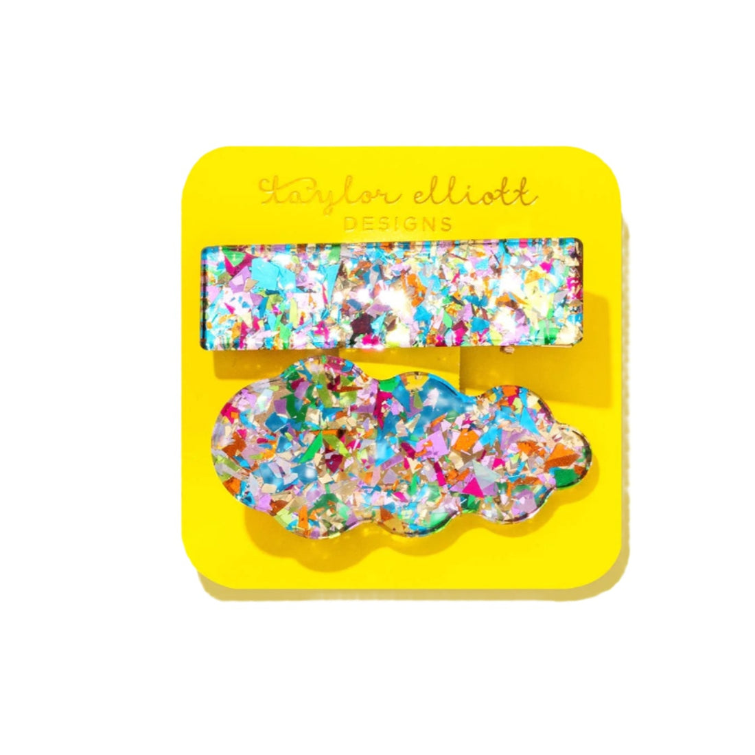 Colorful hair clips on a yellow card