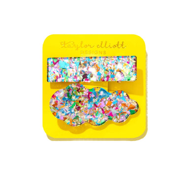 Colorful hair clips on a yellow card