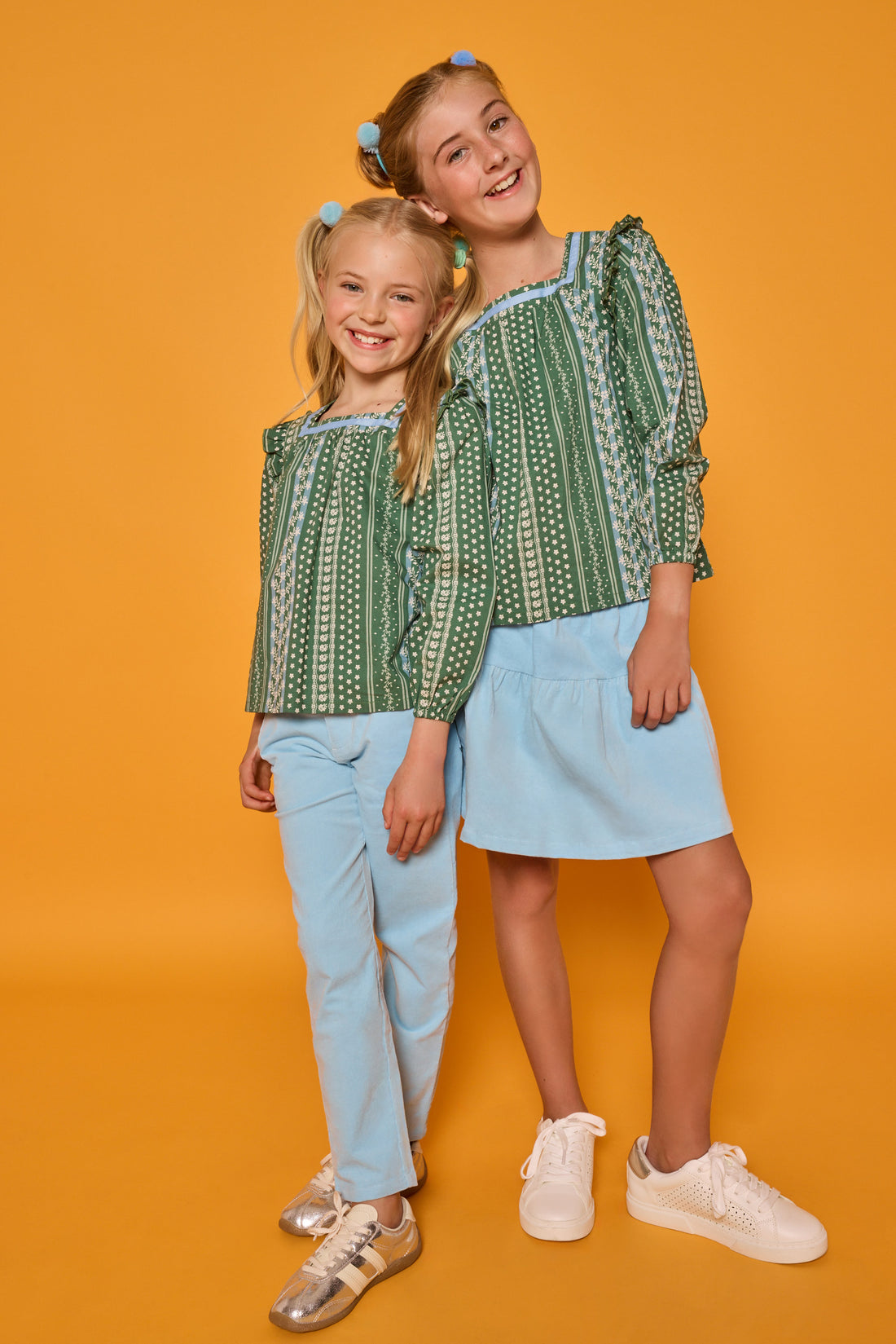 Models can be seen wearing woven long sleeved top with square neckline in a blue/white/green floral print. Paired back perfectly with the light blue corduroy pants or skort to complete the look. 