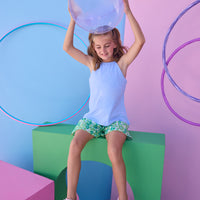 Tween model can be seen wearing a knit light blue halter tank top that features button closure along back and made of a soft comfy material. Top pairs back perfectly with woven shirred shorts in a beautiful green/light blue print to complete the look. 