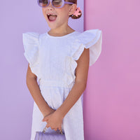 Model can be seen wearing a white woven embroidery material. Dress features big angel sleeve detail and almost full open back for an elevated look. 