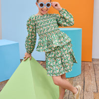 Model can be seen wearing two tiered woven skort in a green/blue/orange floral that features an elastic waistband and built in shorts for a relaxed but secure fit. Pair back the skort perfectly with the matching long sleeve woven top to complete the look. 