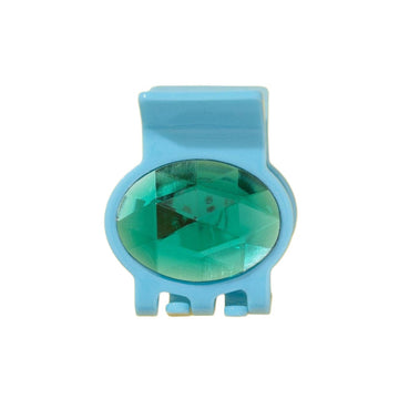 Blue hair clip with a green gemstone on a white background