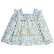 Woven long sleeve square neck top that features a light blue ribbon detail along neckline and elastic cuffs at sleeves for a relaxed but secure fit. Top is also seen to be in  a gorgeous blue/green/white floral pattern.