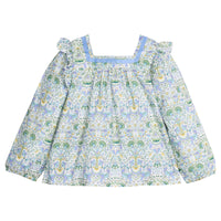 Woven long sleeve square neck top that features a light blue ribbon detail along neckline and elastic cuffs at sleeves for a relaxed but secure fit. Top is also seen to be in  a gorgeous blue/green/white floral pattern.