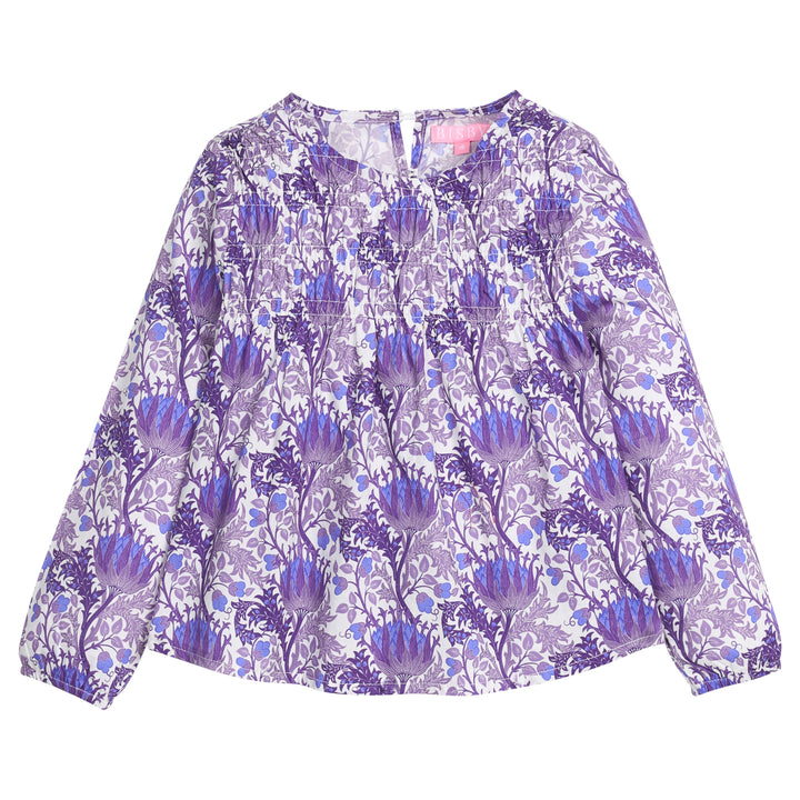 Tween girls woven top that features a button closure at back of neckline, ruching across bust, and elastic cuffs at sleeves for a relaxed but secure fit. Top is also in a beautiful blue/purple/white floral print. 