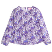 Tween girls woven top that features a button closure at back of neckline, ruching across bust, and elastic cuffs at sleeves for a relaxed but secure fit. Top is also in a beautiful blue/purple/white floral print. 