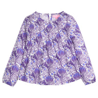 Tween girls woven top that features a button closure at back of neckline, ruching across bust, and elastic cuffs at sleeves for a relaxed but secure fit. Top is also in a beautiful blue/purple/white floral print. 