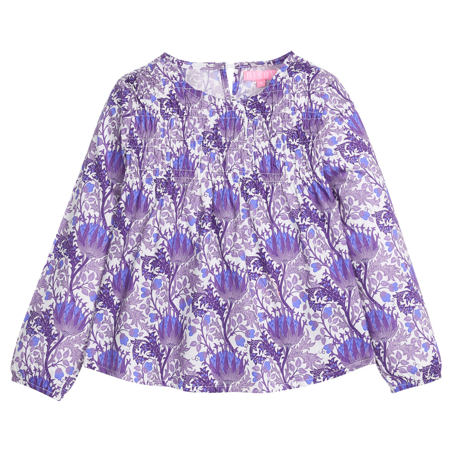 Tween girls woven top that features a button closure at back of neckline, ruching across bust, and elastic cuffs at sleeves for a relaxed but secure fit. Top is also in a beautiful blue/purple/white floral print. 