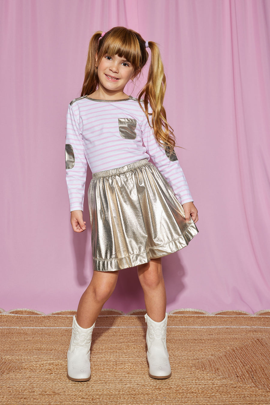 Model can be seen wearing our Breton Top in Pink Stripe paired with our Gold Lame Circle Skirt to complete the look-BISBY girl