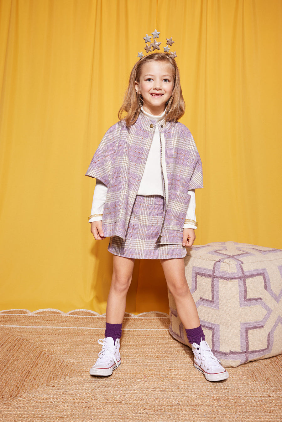 Model seen wearing BISBY Cape in Lilac Tweed with our Ribbed Turtleneck in Ivory layered underneath. We easily pair our Cape with our matching Mini Skirt in Lilac Tweed-BISBY GIRL