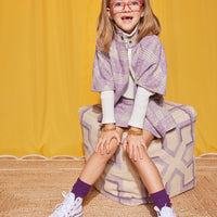 Model can be seen wearing our Mini Skirt in Lilac Tweed paired perfectly with our Cape in Lilac Tweed to complete the set. For layering, we have added our Ivory Ribbed Turtleneck underneath our Cape--BISBY girl 
