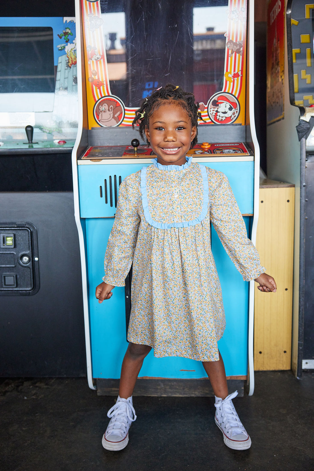 Little girl can be seen wearing our Chelsea Dress in our Devon Floral Amber-BISBY girl