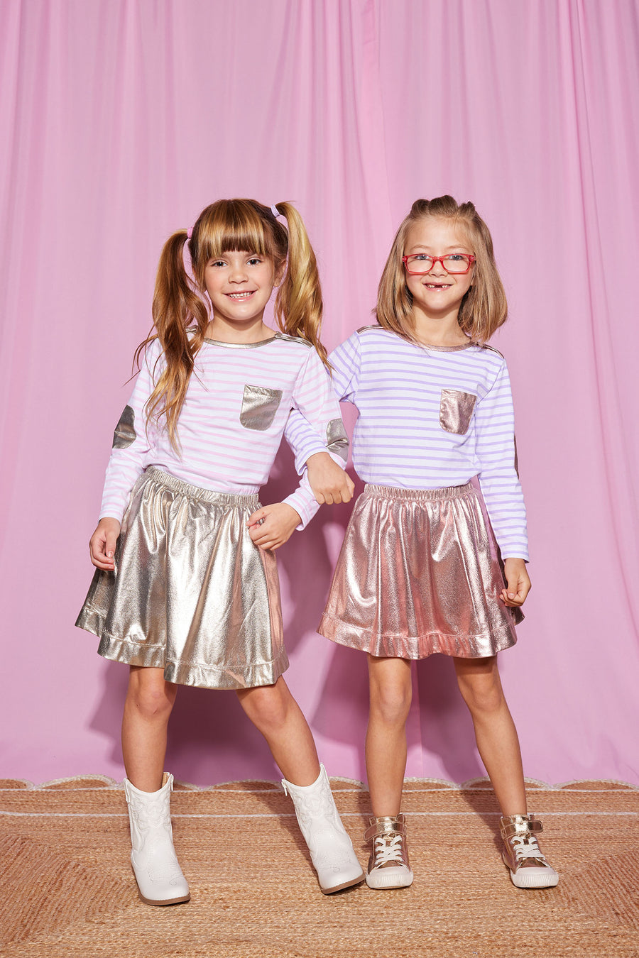 Girls can be seen wearing our Breton Tops in Lilac Stripe and Pink Stripe. We have paired the tops with our Circle Skirts in Pink Lame (left) and our Gold Lame (right)-BISBY girl