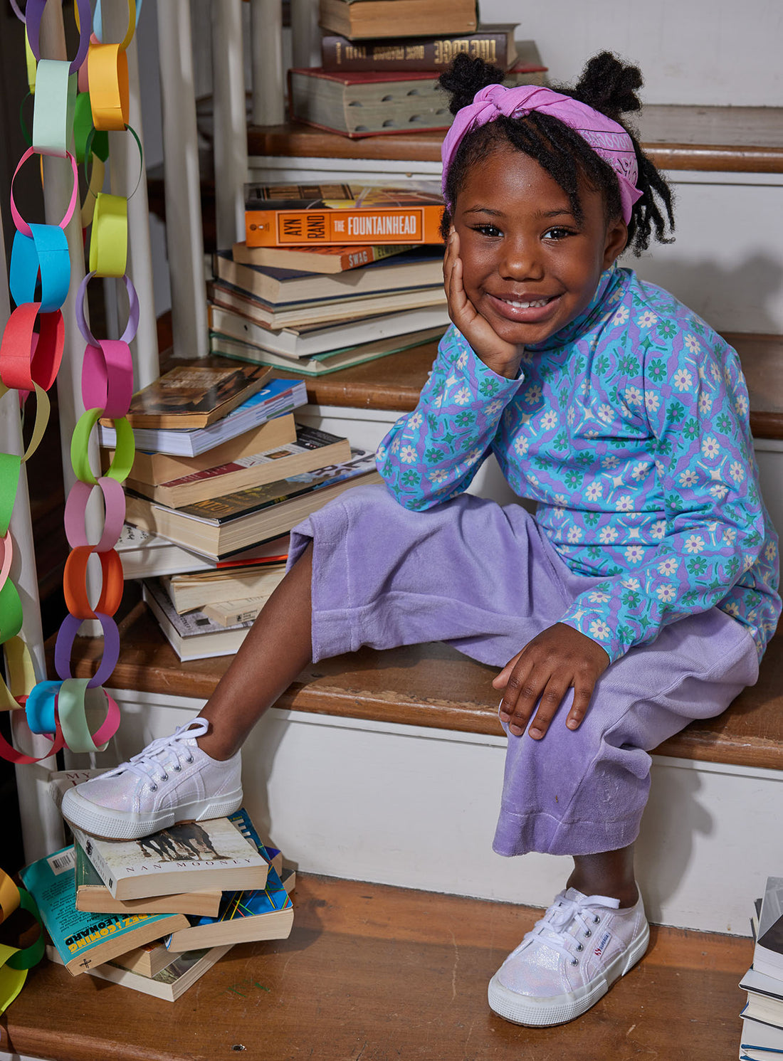 Little girl can be seen wearing our Seville Azul long sleeve turtleneck paired with our Lilac Cropped Velour Palazzo Pant--BISBY girl