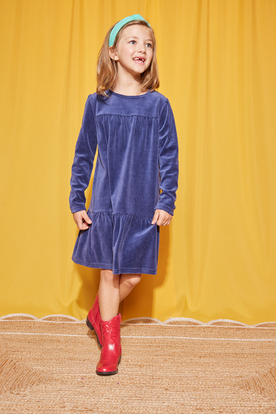 Model can be seen wearing our Lisle Dress in Navy Velour-BISBY girl