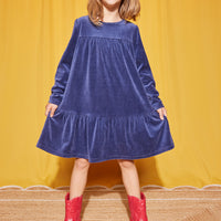 Our model can be seen wearing our Lisle Dress in our Navy Velour color--BISBY girl