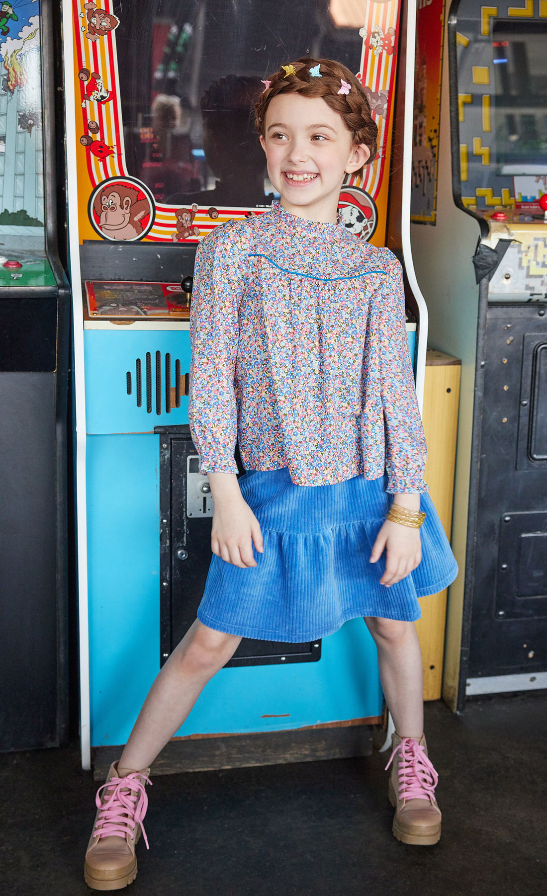 Model can be seen wearing our Sally Skort in French Blue Corduroy paired perfectly with our McCall Top in Devon Floral Blue--BISBY girl