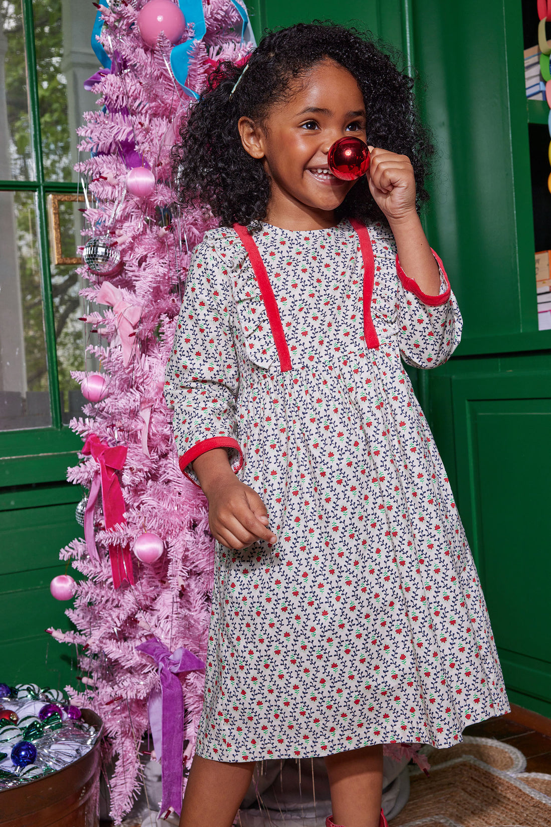 Little girl can be seen rocking our Porto Dress in our Christmas Vine floral pattern-BISBY girl