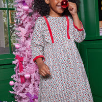 Little girl can be seen rocking our Porto Dress in our Christmas Vine floral pattern-BISBY girl