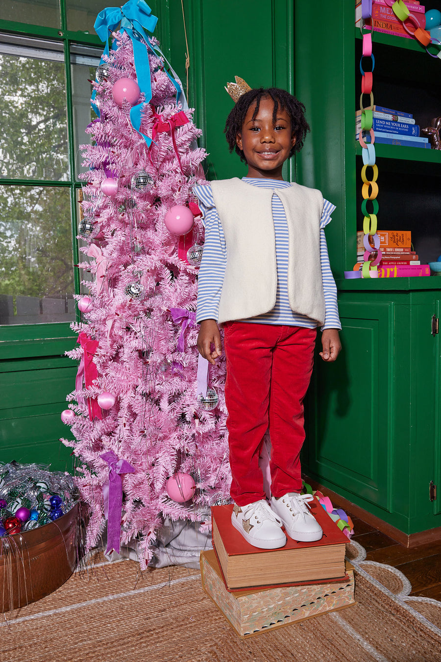 Our little model can be seen wearing our Twiggy Pants in our Red Velvet which pair great with our Sadie Top in French Blue Sparkle Stripe, which is layered underneath our fabulous Cream Sherpa Vest-BISBY Girl