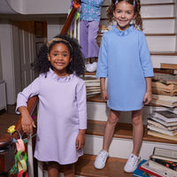 Our models in the front can be seen rocking our Tory Dresses with the ruffled neckline  in Lilac and Light Blue. Our model in the back can be seen wearing our Seville Azul Turtleneck paired with our Cropped Palazzo Pants in Lilac Velour--BISBY girl