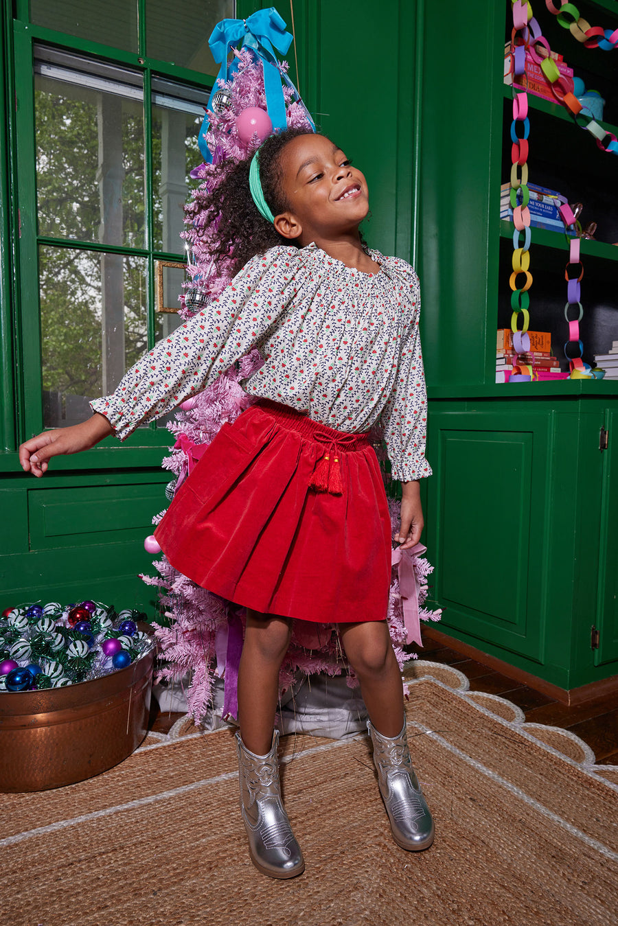 Model can be seen wearing our Circle Skirt in Red Velvet paired with our Tory Top in our Christmas Vine print to complete the look-BISBY girl