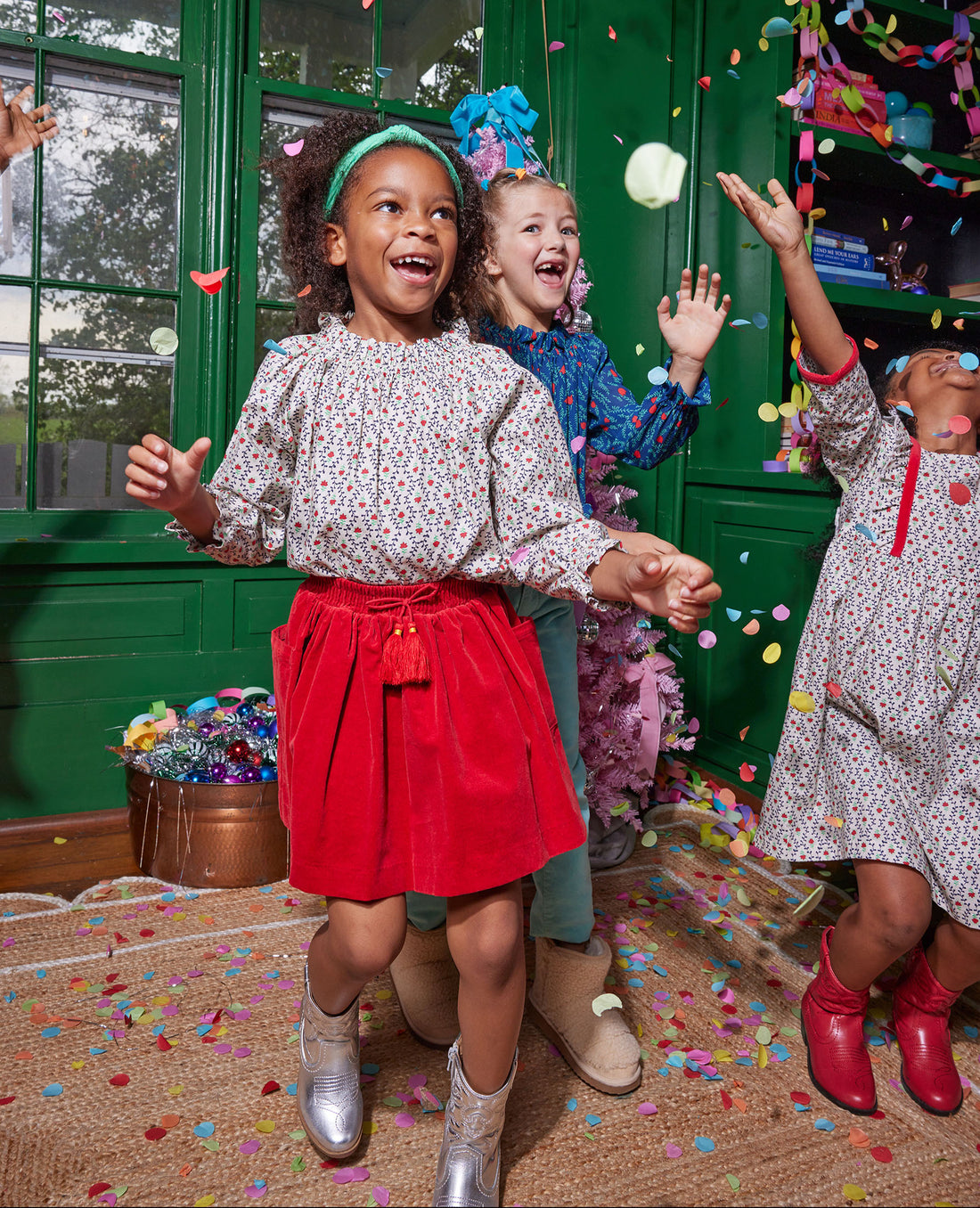 Model can be seen wearing our Circle Skirt in Red Velvet paired with our Tory Top in our Christmas Vine print to complete the look. Also seen is our Porto Dress that also comes in our Christmas Vine floral--BISBY girl