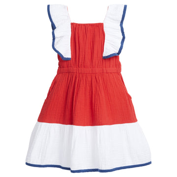 BISBY girl Brighton Dress in Red and White is made out of a soft "gauzy" material, making it super lightweight and soft. It has pockets and an elastic waistband for a relaxed but fun fit. The ruffles along the shoulders and into the front are lined in a navy piping and so is the bottom tier of the dress.