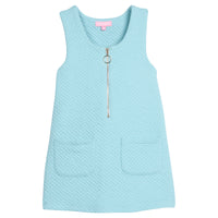 Girls/tween quilted jumper in aqua that features functional pockets in front of jumper and gold quarter zip sweater for an elevated look.