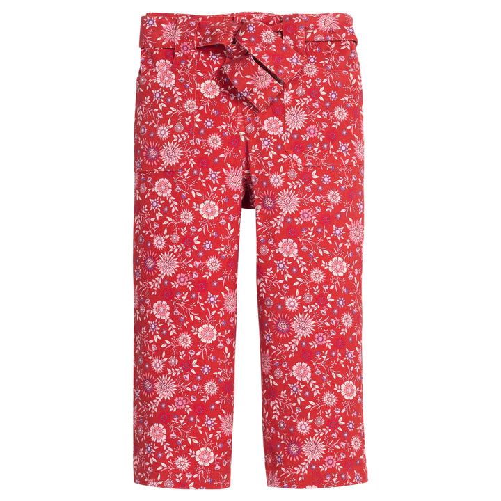 Girls red floral woven pant that features a button closure, two functioning pockets, and a functioning belt to complete the look.