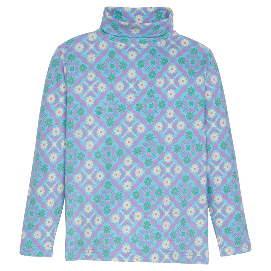 Our super soft long sleeve turtleneck back in our Seville Azul print. It features a fun green/cream/blue and purple print--BISBY