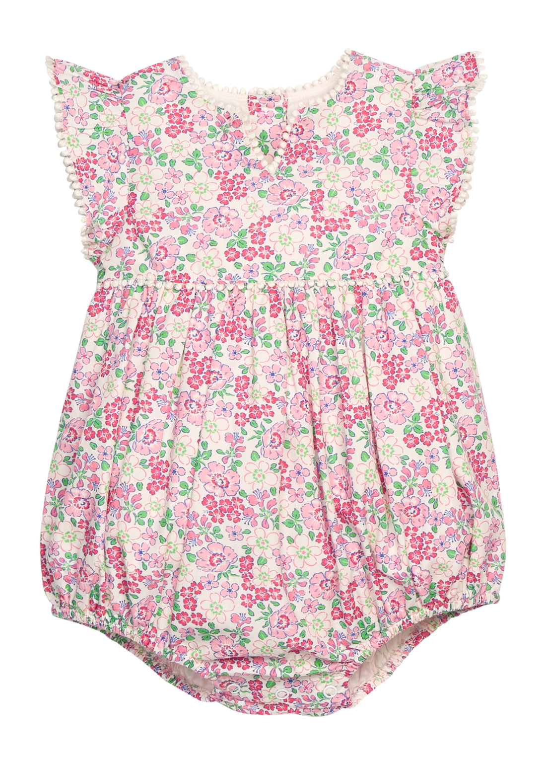 BISBY baby knit bubble in a pink/green floral print. Bubble features button closure along back and stride, white pom pom detail across the middle/bust area, and white pom pom detail along sleeve cuffs for an elevated look.