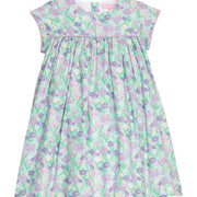 BISBY girl woven dress in an aqua/purple/blue floral print. Dress features three button closure at back and matching purple trim across bust and end of sleeves for a completed look.