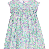 BISBY girl woven dress in an aqua/purple/blue floral print. Dress features three button closure at back and matching purple trim across bust and end of sleeves for a completed look.
