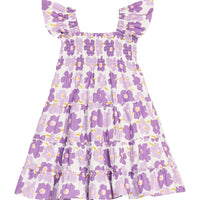 BISBY girl woven dress in a purple floral print. Dress features angel sleeves, smocking across bust, and outside surging detail for an elevated look.