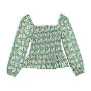 Girls/tween woven top that features ruching across center of shirt and elastic cuffs for a secure but stretchy fit.
