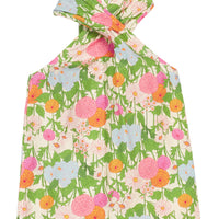 BISBY tween girl woven top in a green/orange/pink/light blue floral print. Top features a crossover neckline feature (scarf) with keyhole button closure at back for an elevated look.