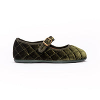 Green quilted velvet shoe with a buckle on a white background mary jane flat for girls